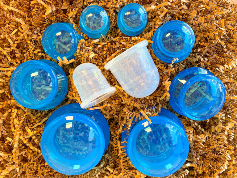 blue and clear silicone cups on brown crinkle paper