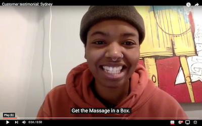 picture of a person smiling with a caption "get the Massage in a Box"