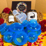 cupping box silicone cups with bath salts massage oil and postcards in brown box with red flowers